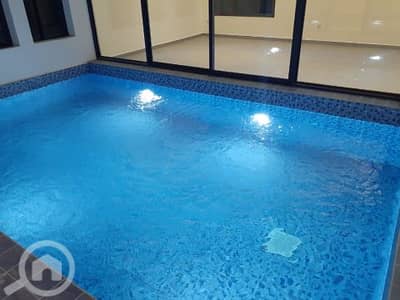 7 Bedroom Villa for Rent in Fnaitees, Kuwait City - Villa with elevator, pool, and garden available for rent in Funaitees.