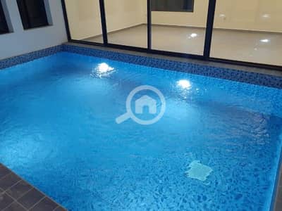 7 Bedroom Villa for Rent in Fnaitees, Kuwait City - Villa with elevator, pool, and garden available for rent in Funaitees